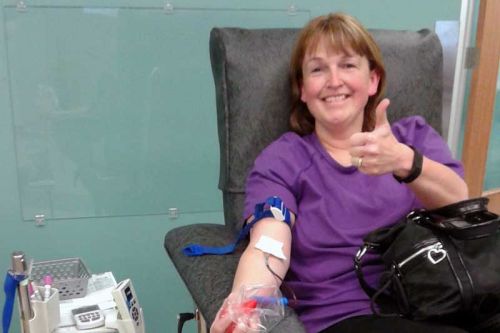 Rhonda Watkins makes a blood donation
